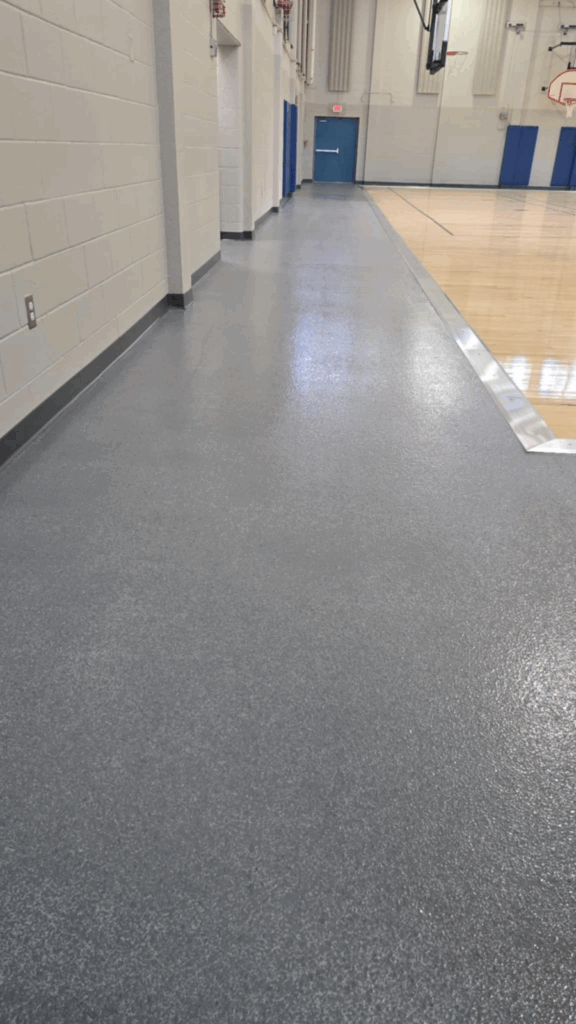 Grey flake epoxy system on gym floor of lake vista recreation center